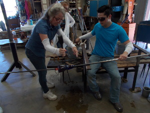 Instructor helping student.